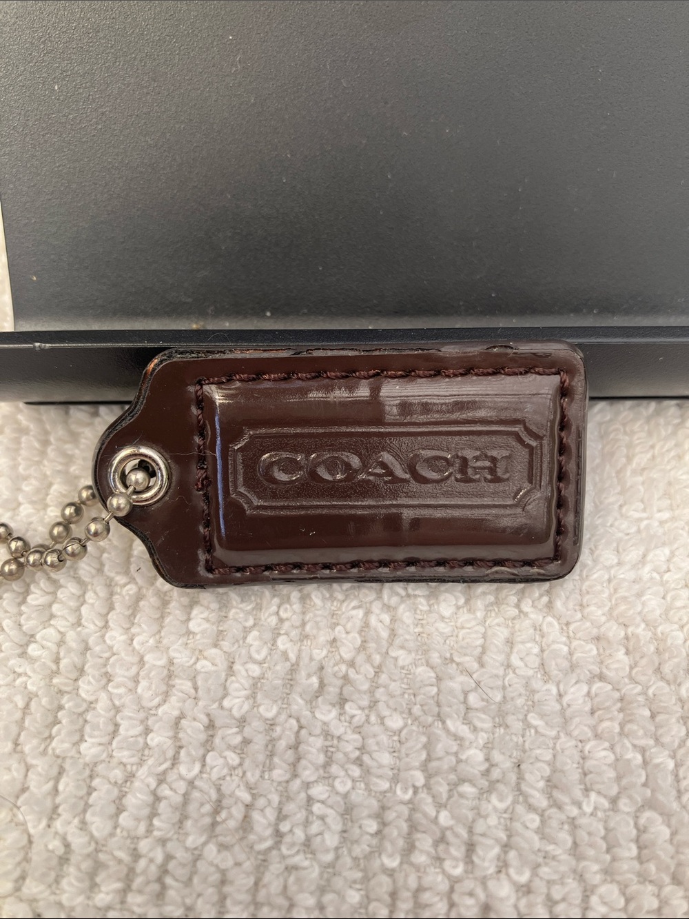Coach 1-3/4” Brown Patent Leather Hang Tag
